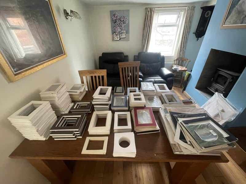 A table full of picture mounts